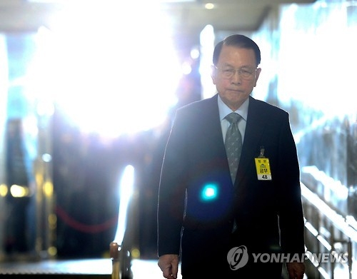 金淇春步入聽證會。(韓聯社)